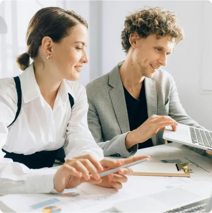 Man and woman focused on computer