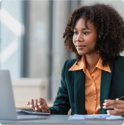 Female professional using laptop